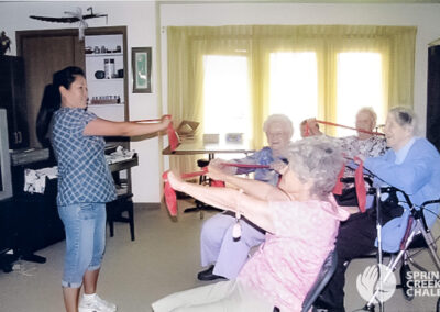 Senior women attending exercise classes in the Spring Creek Chalet retirement home.