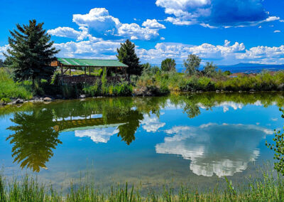 A beautiful pond reflecting the astonishing landscape in the Montrose County retirement community.